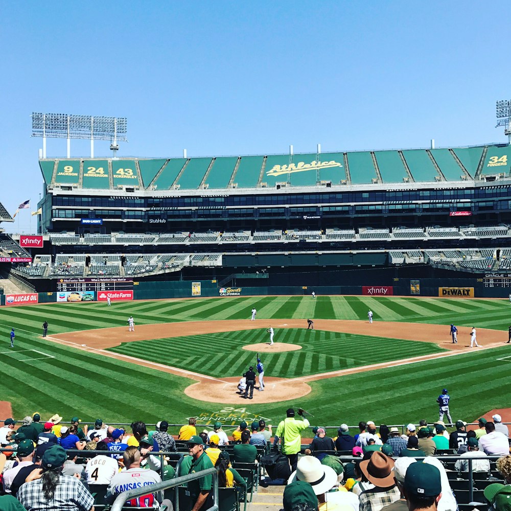 photo of people watching game baseball match on baseball field