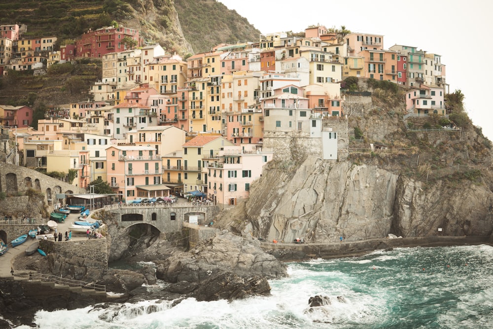 landscape photography of houses in the mountain cliff