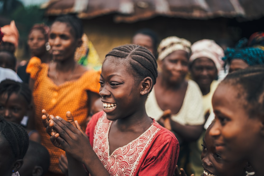 woman looking at the ground while smiling