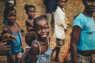 children smiling closeup photography