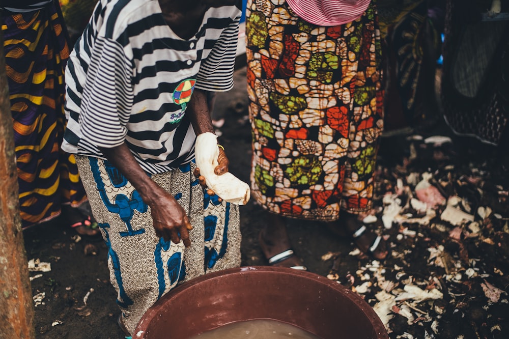 person white cloth near pail