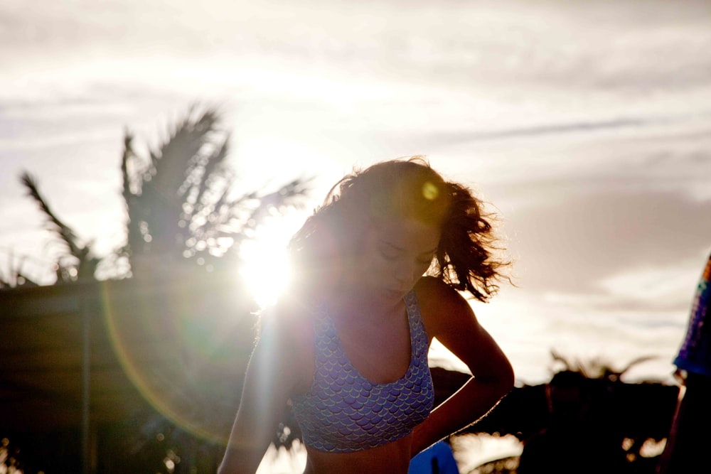 woman wearing blue tank top