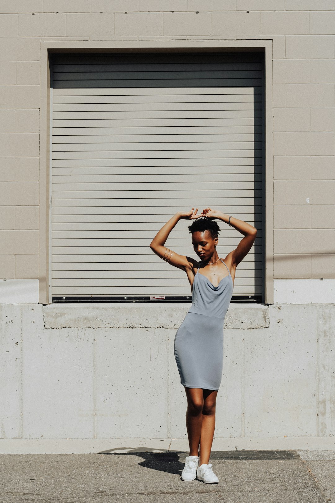 woman standing near white window