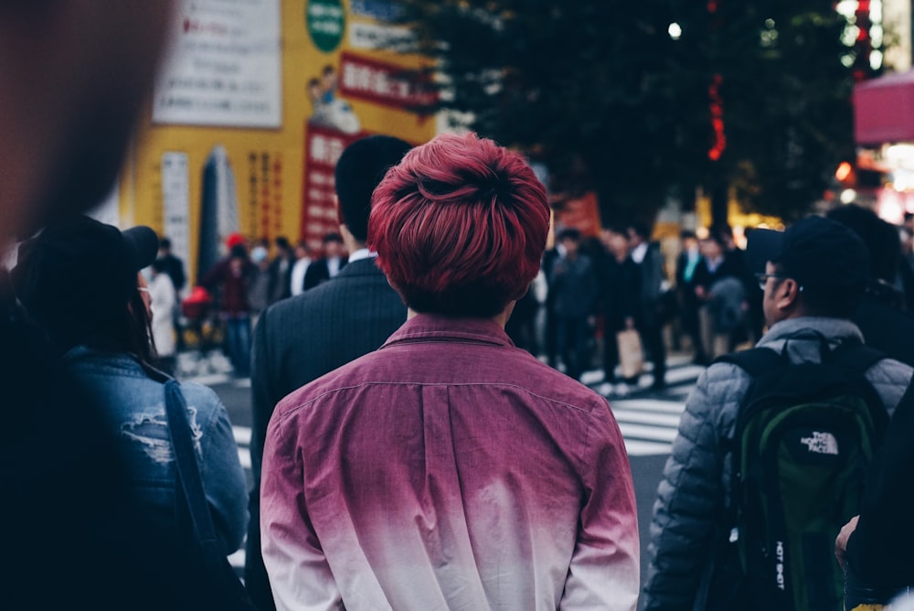 man wearing pink and white collared shirt