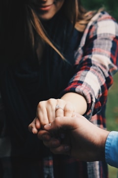 A close-up of hands shaking over a renovation contract, symbolizing trust and commitment.