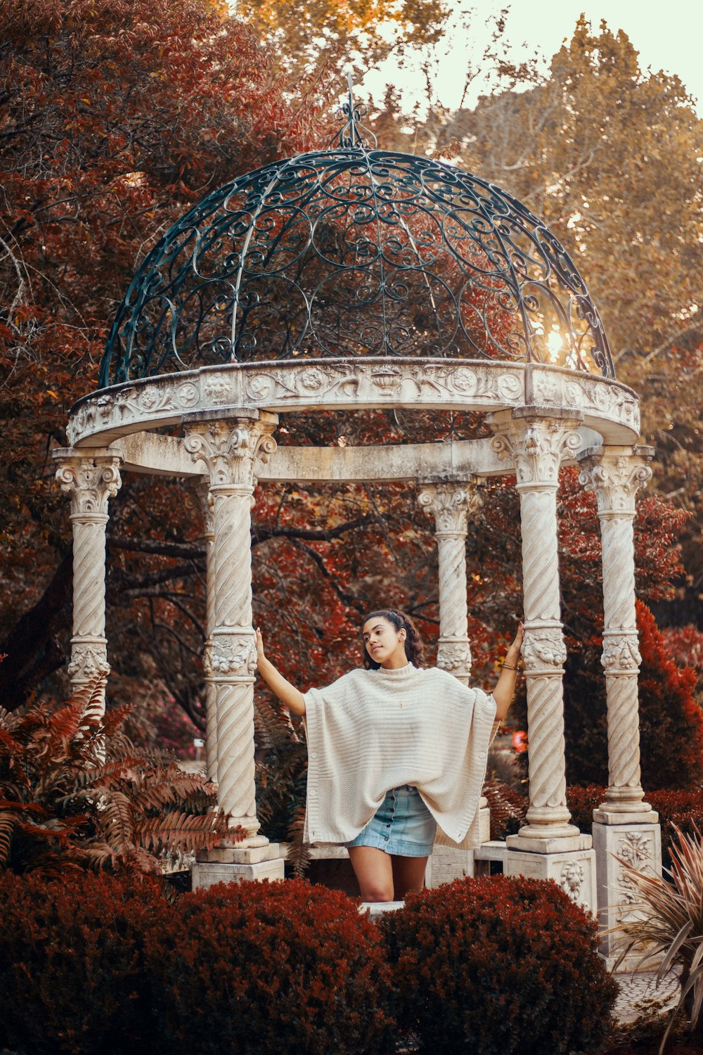 photography of woman holding gazebo post