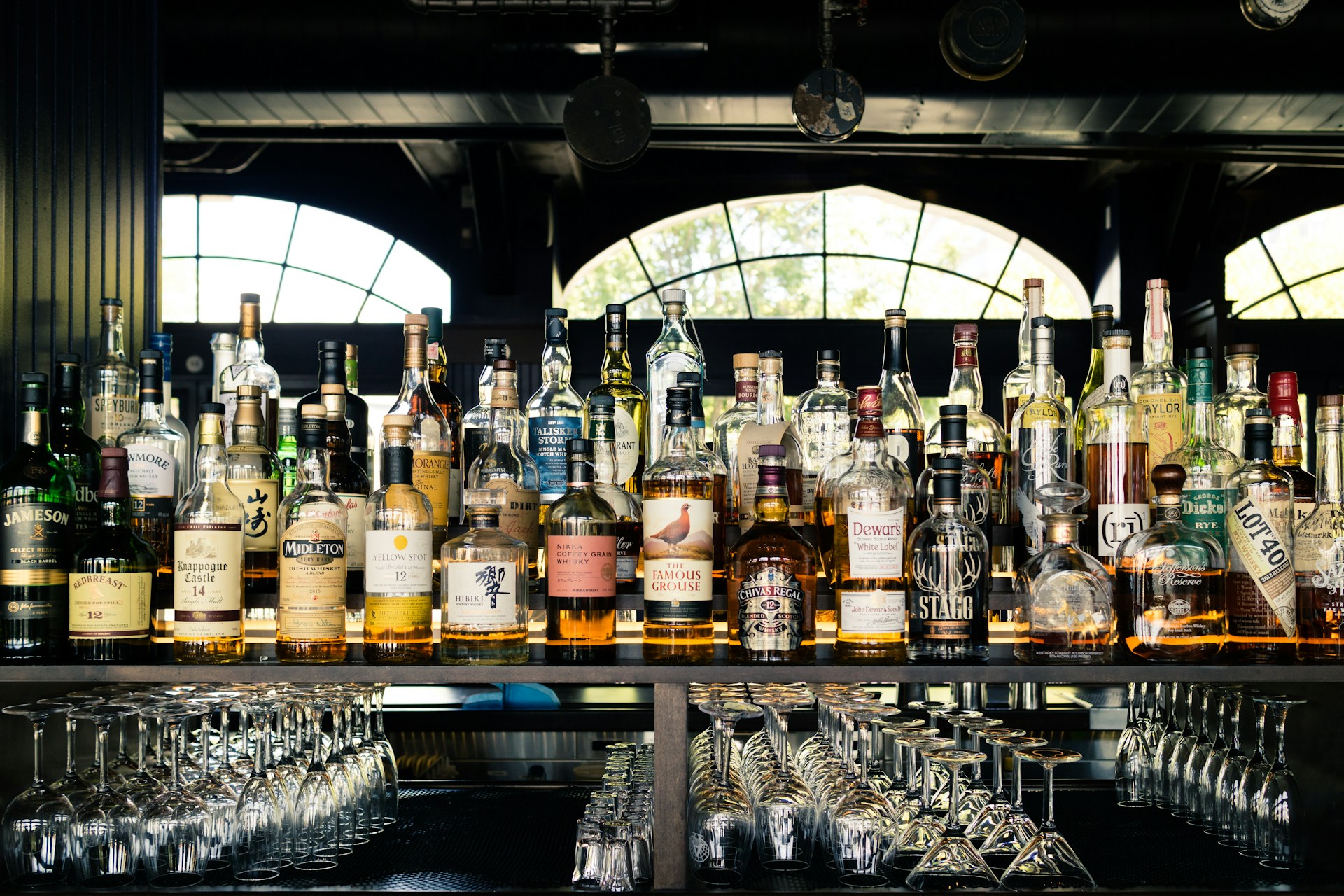 assorted liquor bottles on table