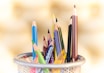 shallow focus photography of pencils on desk rack
