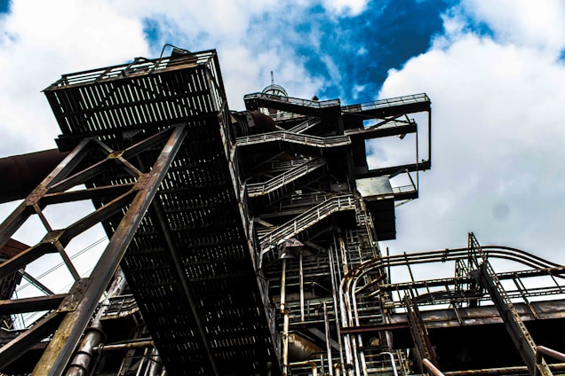 A panoramic view of a modern industrial complex with metal structures under construction.