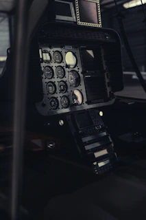 A wide shot of the flight simulator setup in a cozy room with ambient lighting