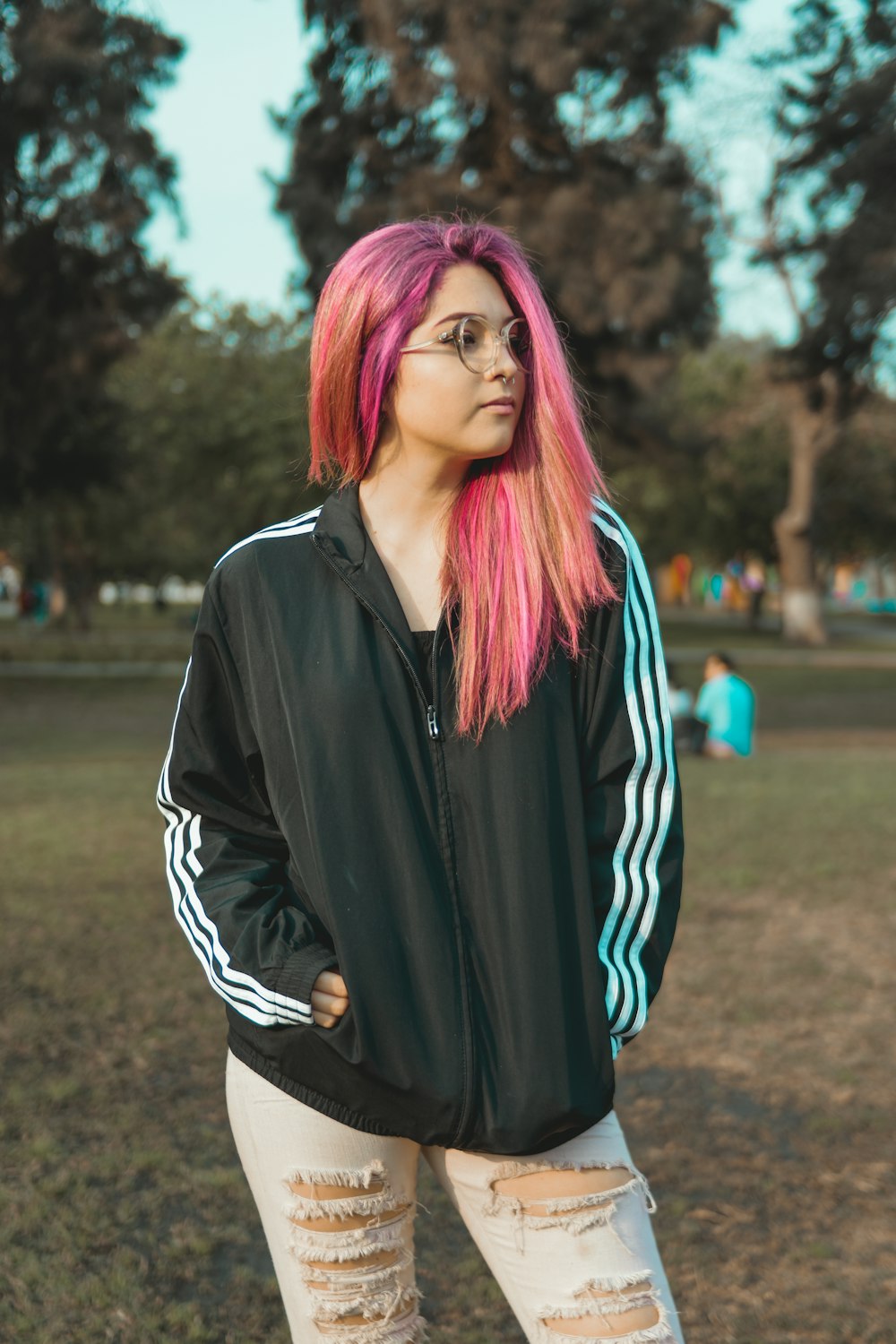 woman putting her hands inside jacket pockets