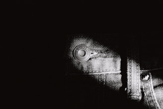 Photo of Obsidia Jeans factory with workers sewing denim garments.