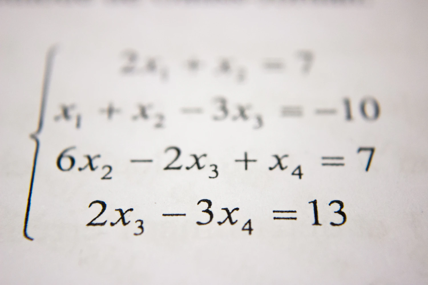 Premium academic workspace with handwritten mathematics equations and solution notes in progress