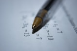 black retractable pen on white printer paper