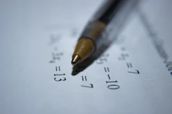 black retractable pen on white printer paper