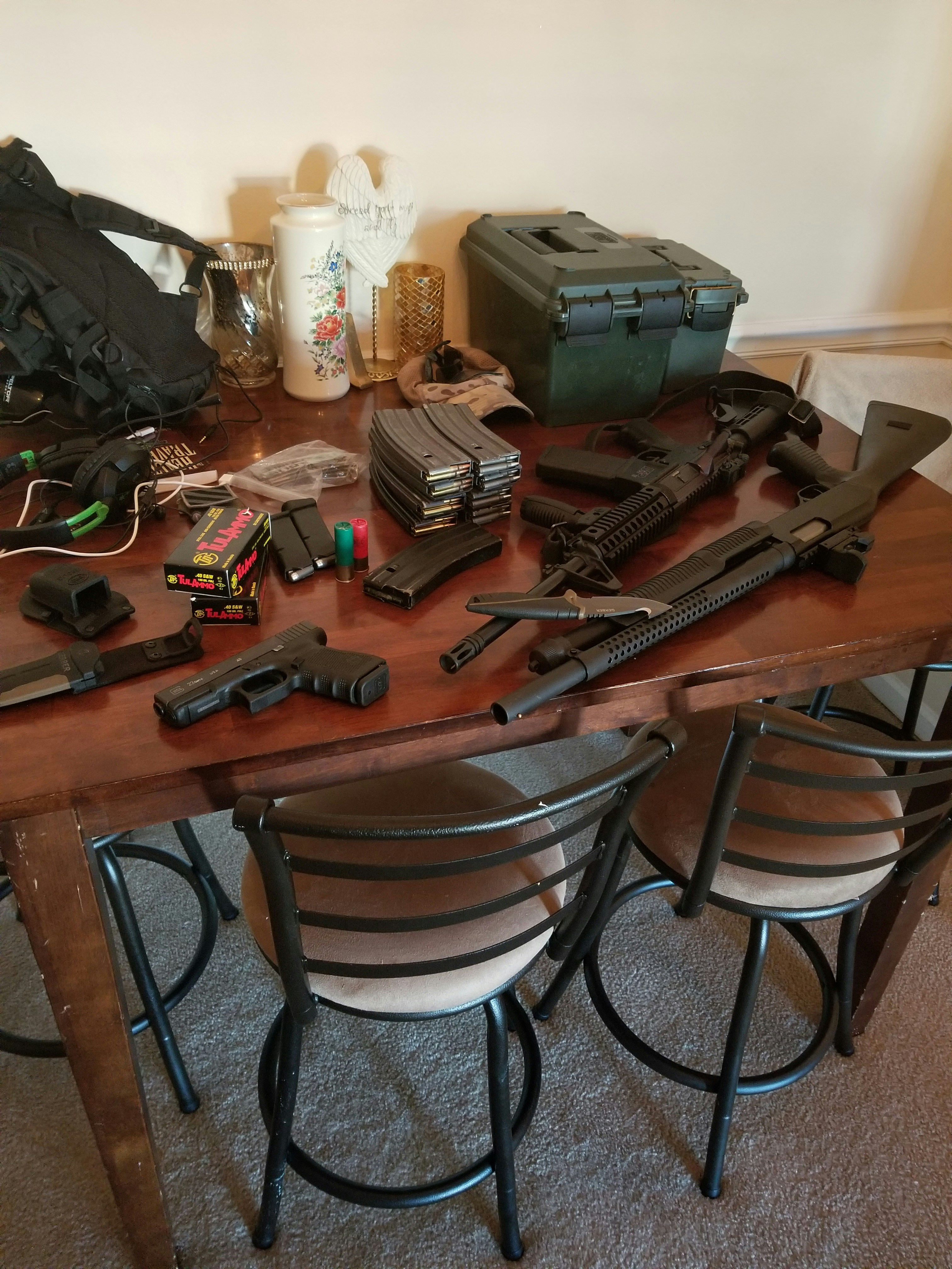 Ammunition rounds and firearm accessories arranged on table