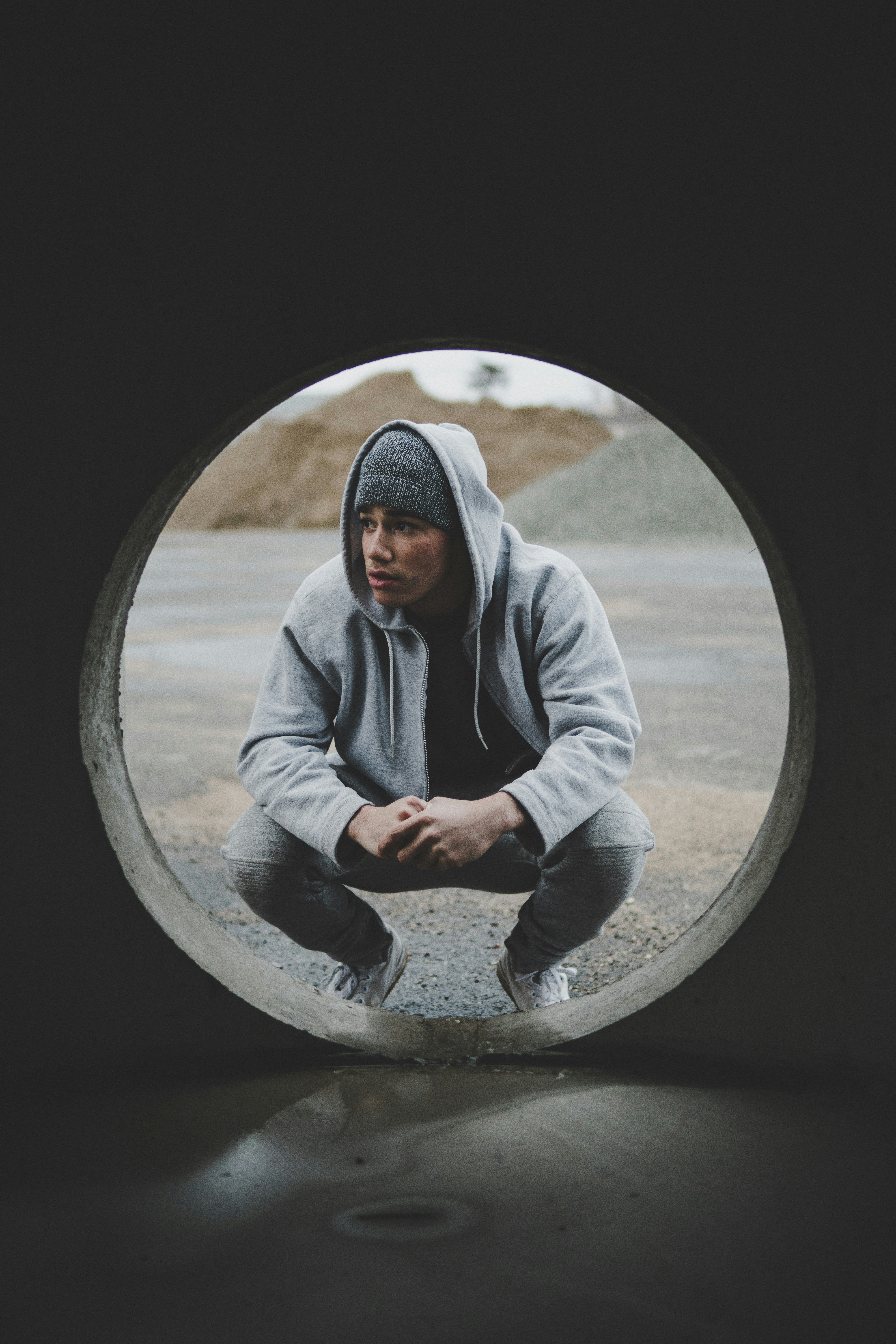 great photo recipe,how to photograph holy; man sitting near gray tunnel during daytime