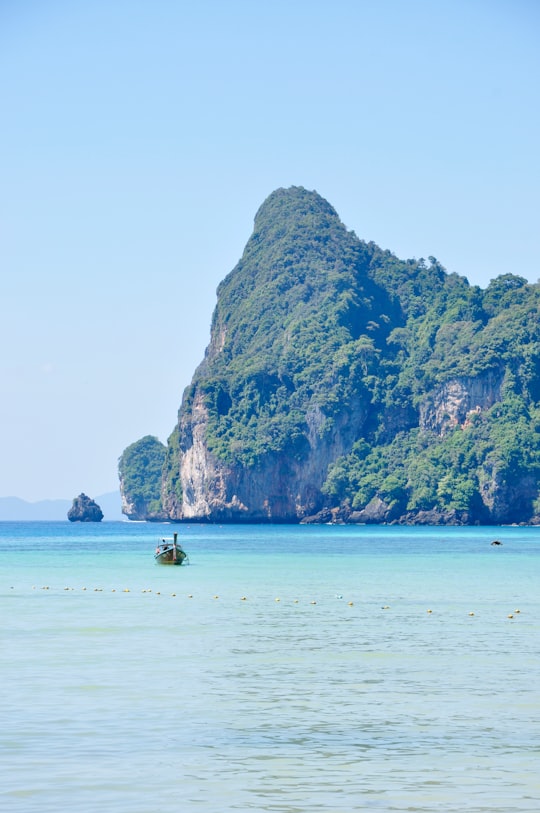 boat on sea far away from island in Loh Dalum Bay Thailand