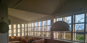 Cozy living room with large windows and natural light.