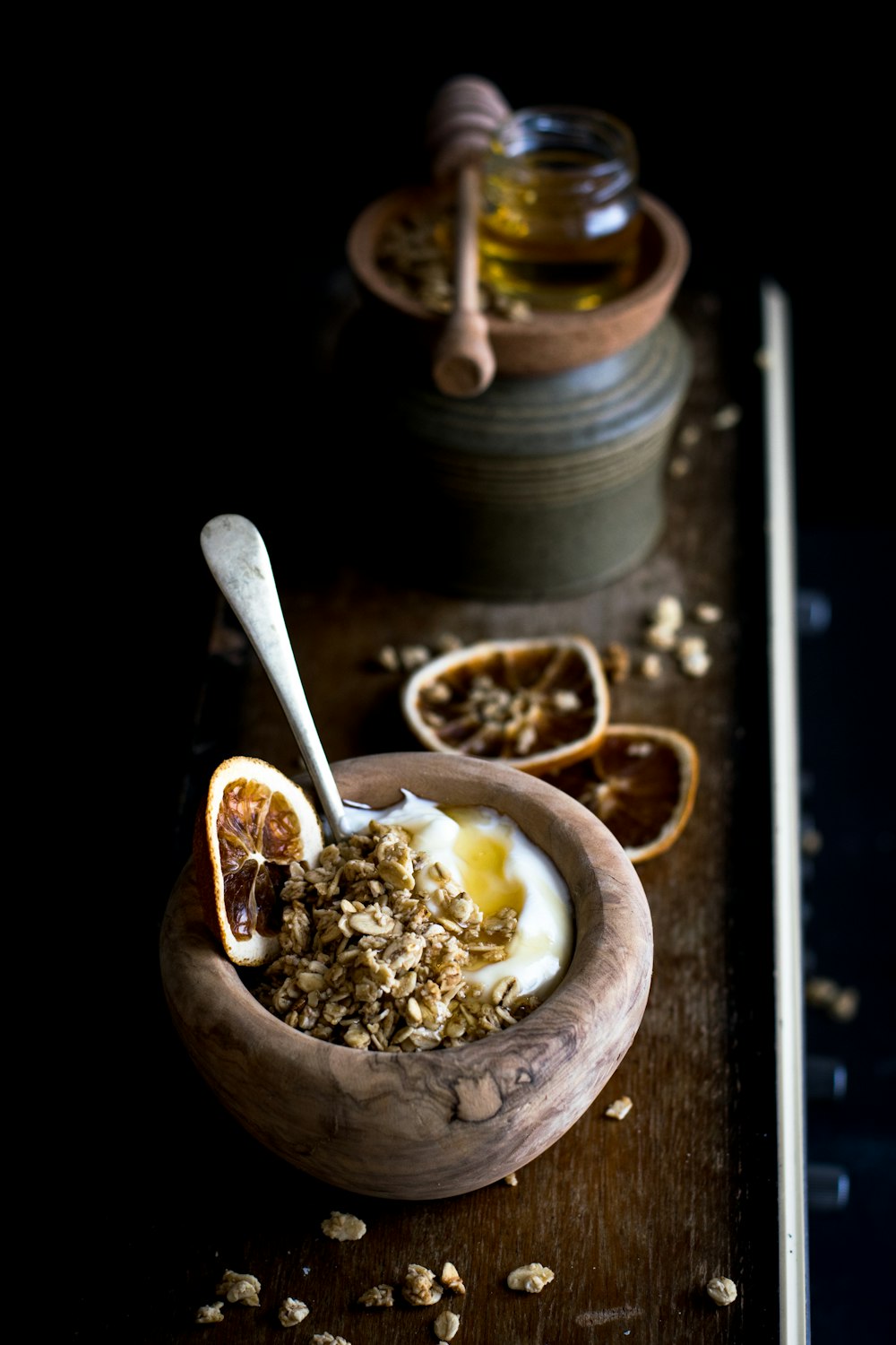 corn with egg on brown wooden bowl with spoon