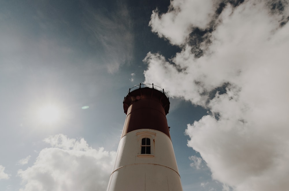 high-angle photography of white and black lighthouse tower during day time