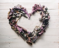 top view of leaves and assorted items formed into heart