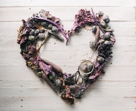 top view of leaves and assorted items formed into heart
