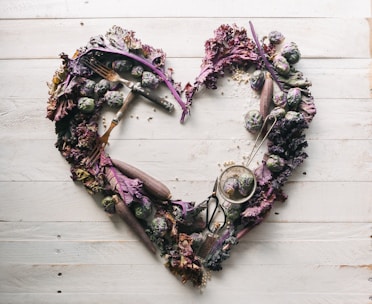 top view of leaves and assorted items formed into heart