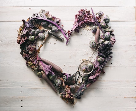 top view of leaves and assorted items formed into heart