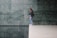 A satisfied customer standing next to beautifully polished marble.