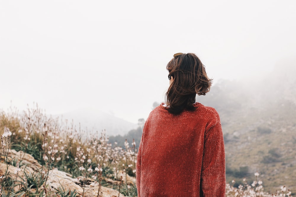 person facing white flower fields