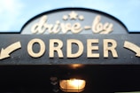 order signage on grey wooden plank