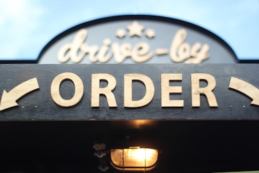 order signage on grey wooden plank