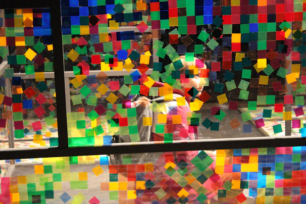 Close-up of personalized stickers arranged creatively on a shop window