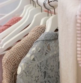 clothes hanging on white rack