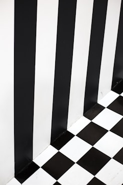a black and white checkered floor and wall