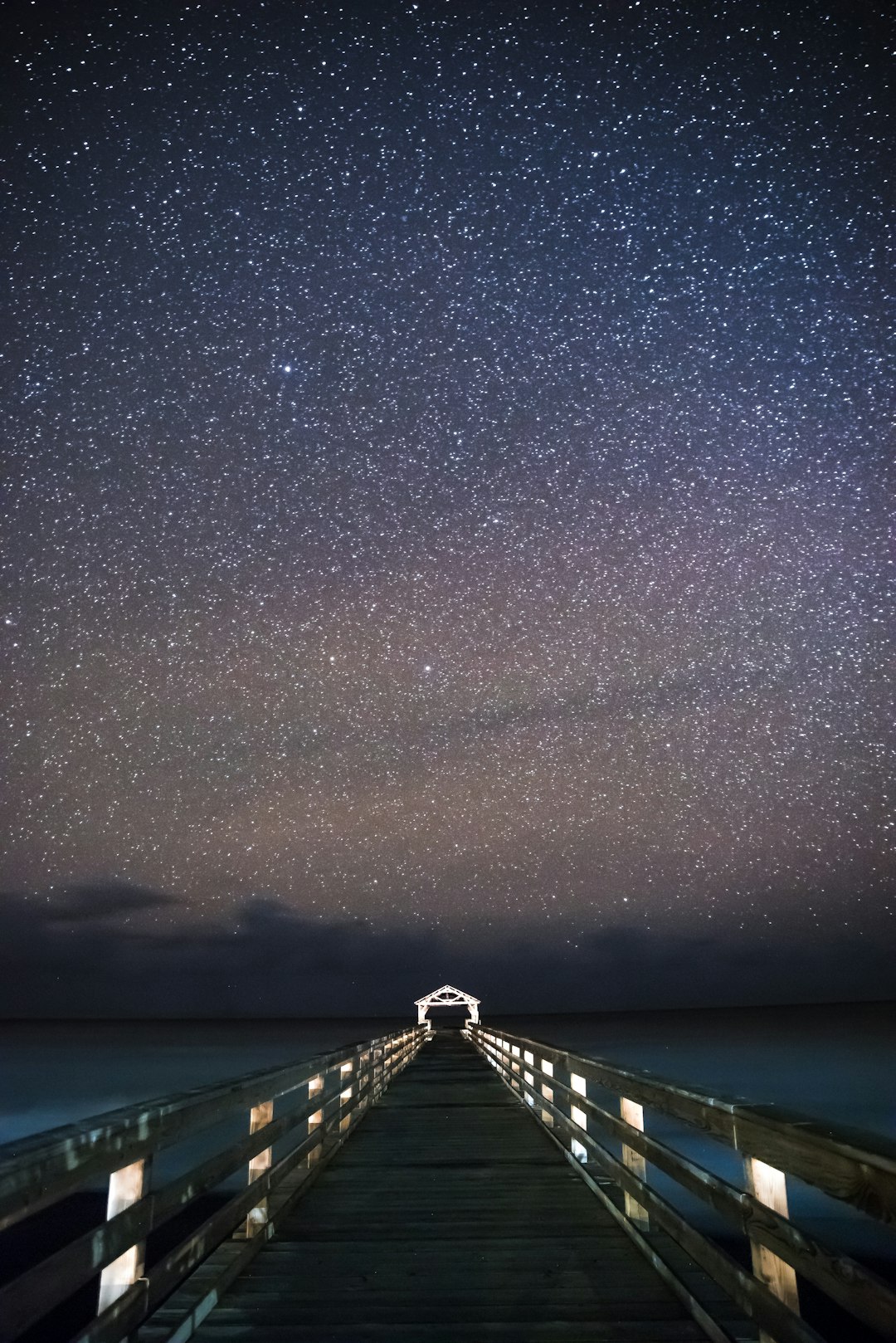 bridge under starry sky