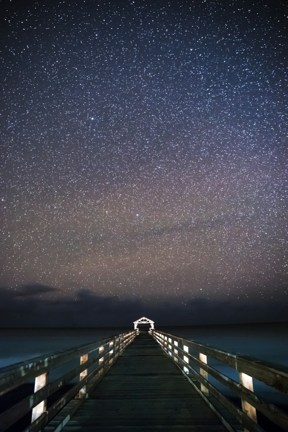 bridge under starry sky