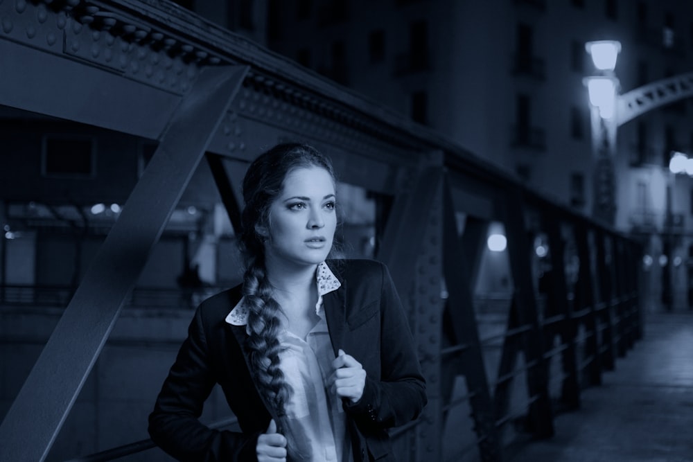 woman standing on bridge