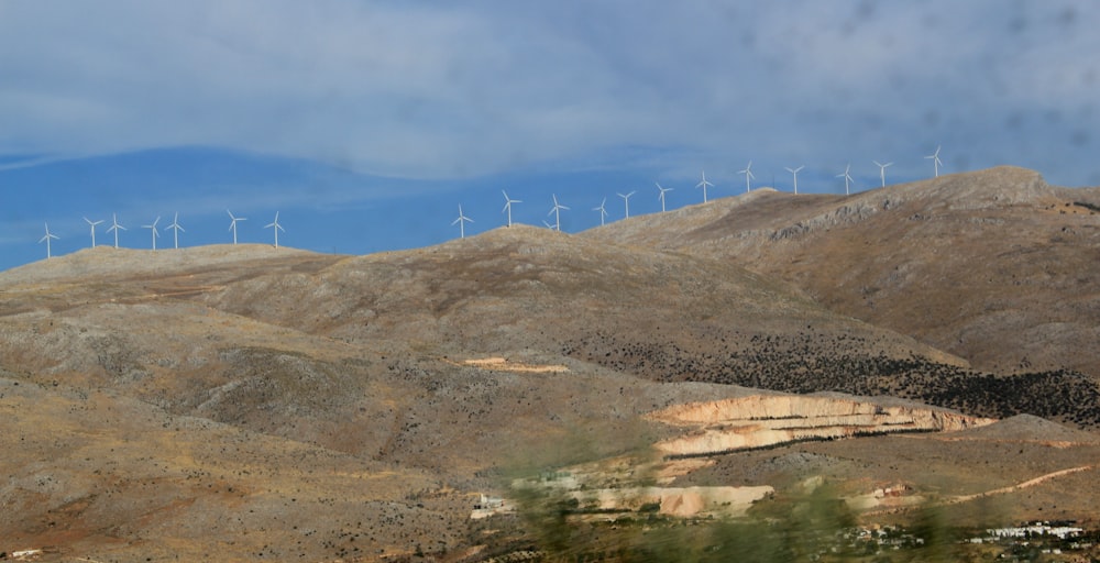 photo of wind turbines on mountain