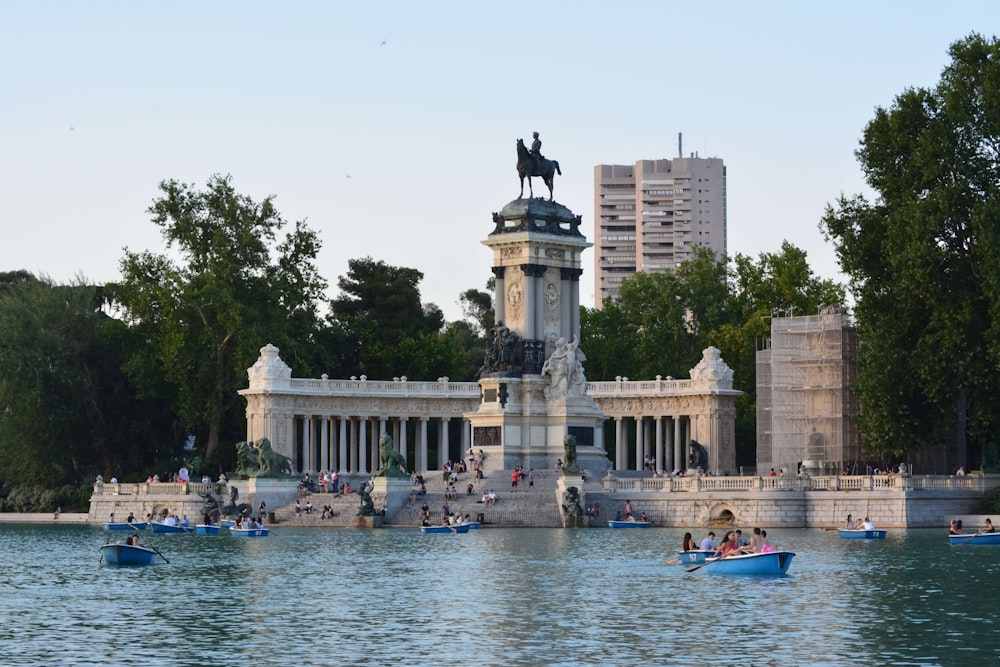 photo of concrete monument near body of water