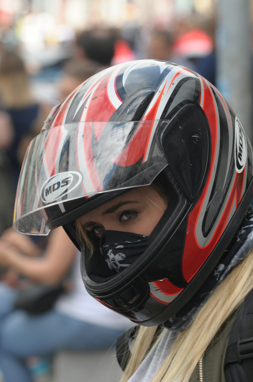 woman wearing black and red MDS full-face helmet focus photography