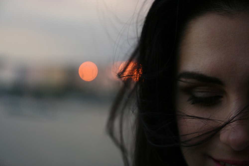 smiling woman with bokeh background