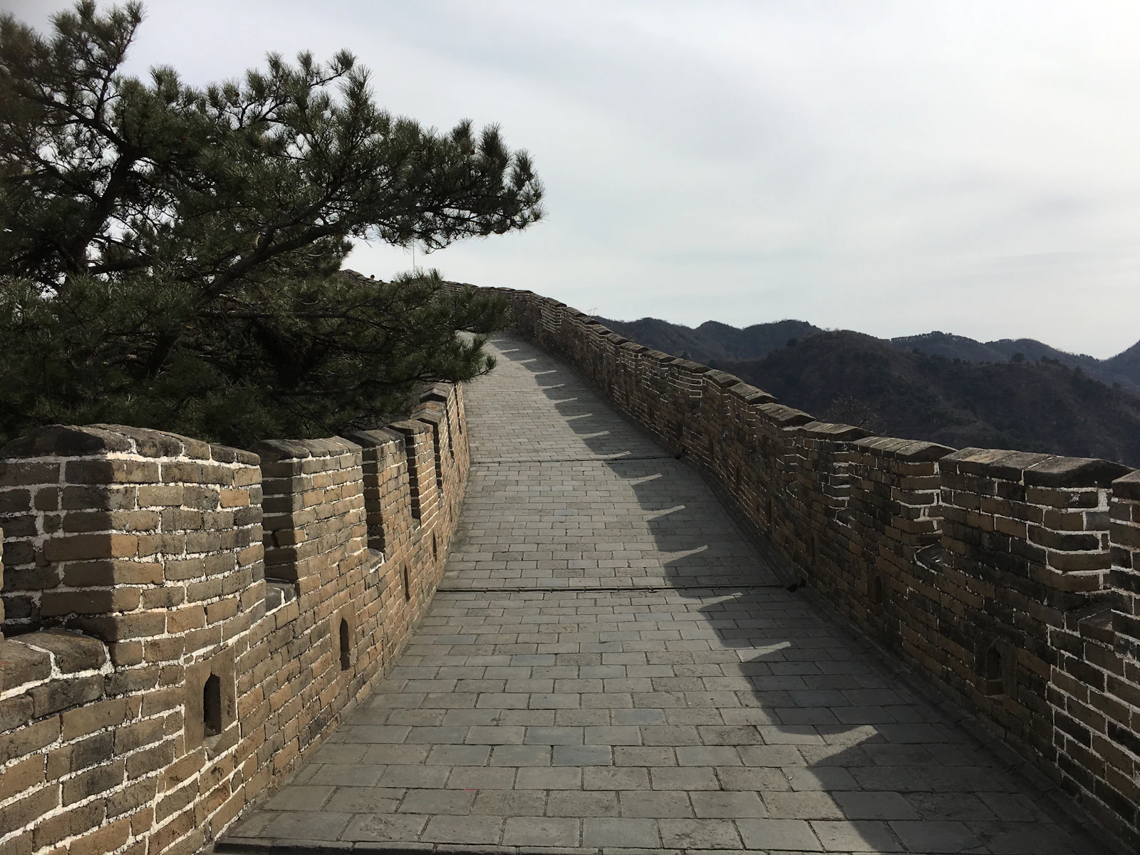 Great Wall of China along green mountain ridges