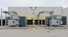 Two utility transformers outside a power facility