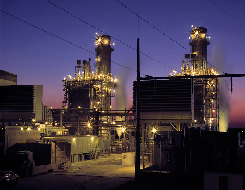 Gas processing facility illuminated at twilight