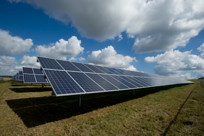 solar panels on green field solar teams background