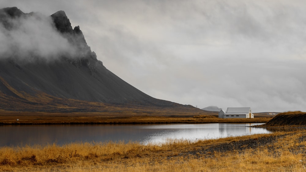 photography of white house near mountain