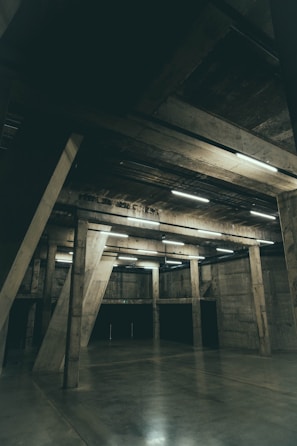 Smooth polished concrete floor with a durable epoxy coating reflecting natural light in a commercial space.