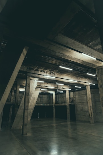 Interior of a spacious industrial space with high ceilings and clean floors